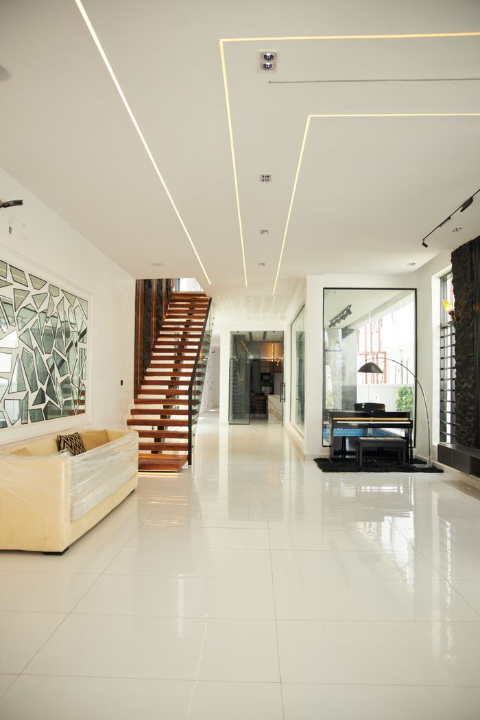 Bright modern interior with sleek design and floating staircase